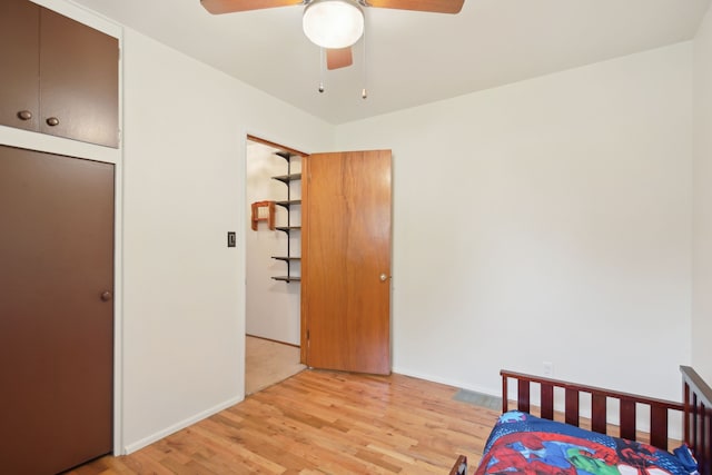 5427 Fiesta Pass, Grand Blanc, MI 48439 - bedroom featuring light wood-style flooring, baseboards, and a ceiling fan