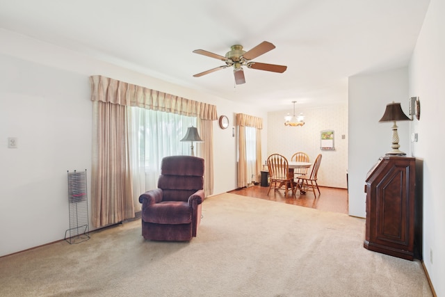 5427 Fiesta Pass, Grand Blanc, MI 48439 - living area featuring carpet floors, a ceiling fan, a chandelier, and baseboards