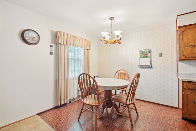 5427 Fiesta Pass, Grand Blanc, MI 48439 - dining room featuring a chandelier, baseboards, brick patterned floors, and wallpapered walls