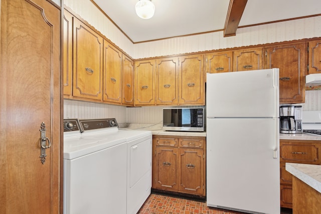 5427 Fiesta Pass, Grand Blanc, MI 48439 - laundry room with separate washer and dryer and brick patterned flooring