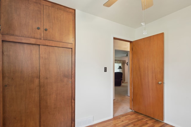 5427 Fiesta Pass, Grand Blanc, MI 48439 - unfurnished bedroom featuring light wood-style flooring, a closet, and a ceiling fan