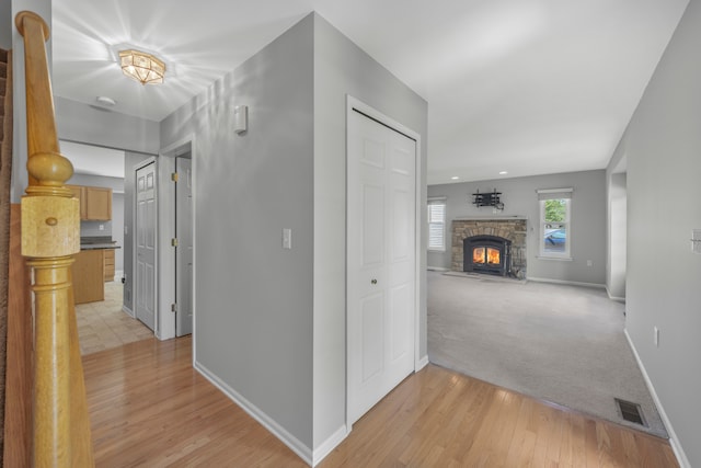 137 Donna, Waterford, MI 48327 - hallway featuring baseboards, light wood finished floors, and light carpet