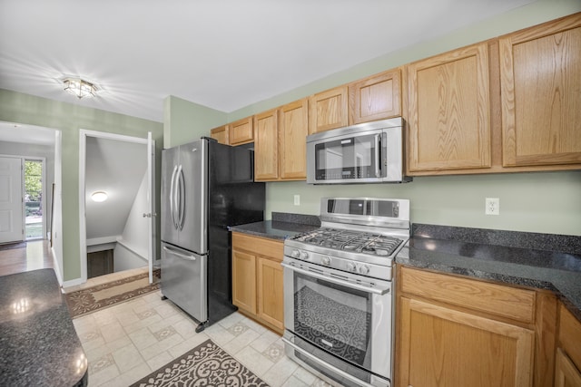 137 Donna, Waterford, MI 48327 - kitchen featuring appliances with stainless steel finishes, light brown cabinets, and dark stone counters