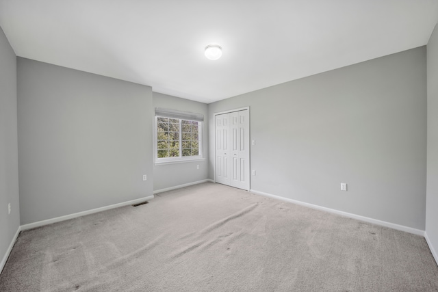 137 Donna, Waterford, MI 48327 - unfurnished bedroom with baseboards, carpet, and a closet