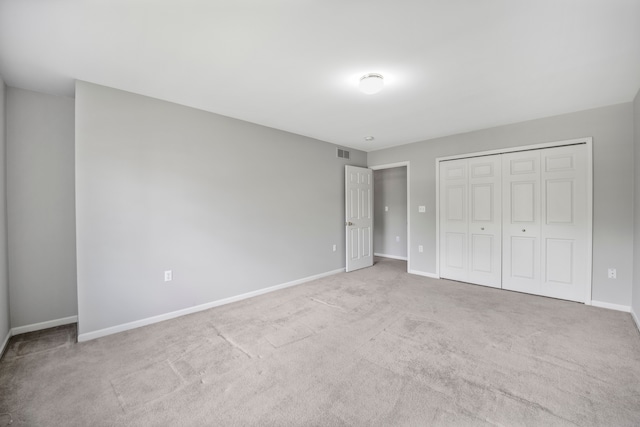137 Donna, Waterford, MI 48327 - unfurnished bedroom featuring baseboards, carpet, and a closet