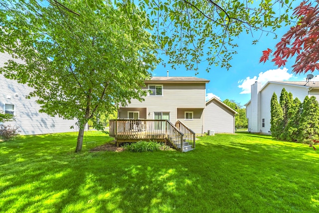 137 Donna, Waterford, MI 48327 - rear view of property featuring a wooden deck and a lawn