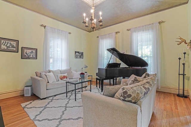 529 Fountain St NE, Grand Rapids, MI 49503 - living area featuring wood finished floors, plenty of natural light, a chandelier, and baseboards