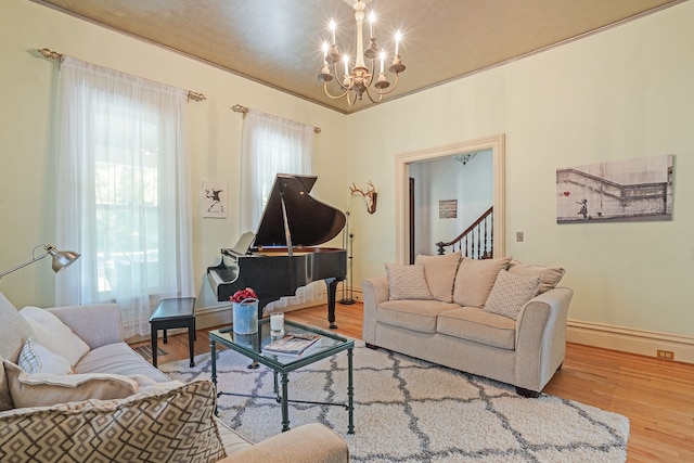 529 Fountain St NE, Grand Rapids, MI 49503 - living area featuring a chandelier, wood finished floors, stairs, and baseboards
