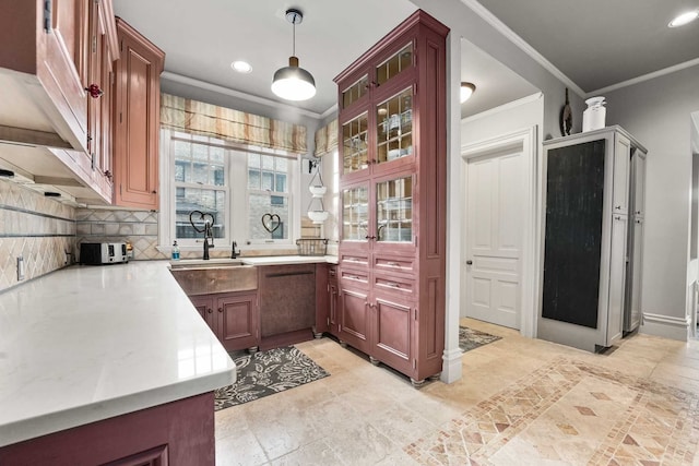 529 Fountain St NE, Grand Rapids, MI 49503 - kitchen featuring ornamental molding, light countertops, decorative light fixtures, tasteful backsplash, and recessed lighting