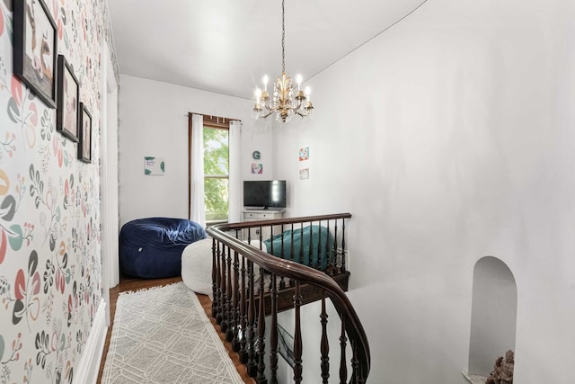 529 Fountain St NE, Grand Rapids, MI 49503 - stairway featuring a chandelier and wood finished floors