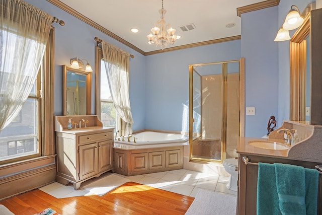 529 Fountain St NE, Grand Rapids, MI 49503 - bathroom featuring a chandelier, vanity, a stall shower, toilet, and ornamental molding
