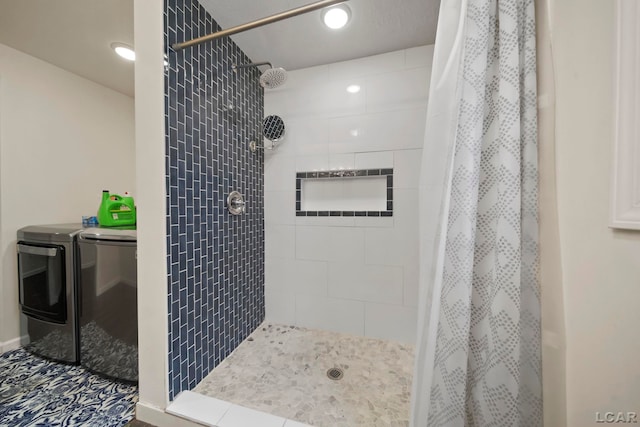 bathroom featuring a shower stall, separate washer and dryer, and recessed lighting