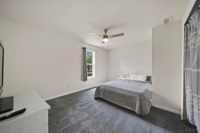 carpeted bedroom with baseboards and ceiling fan