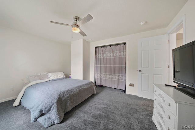 bedroom featuring dark carpet, baseboards, and a ceiling fan
