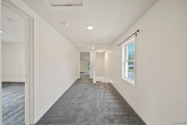 hallway with carpet flooring, recessed lighting, and baseboards