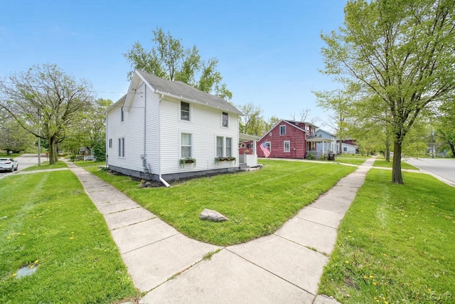 view of property exterior with a lawn
