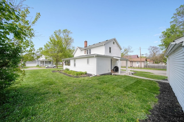 back of property with a chimney