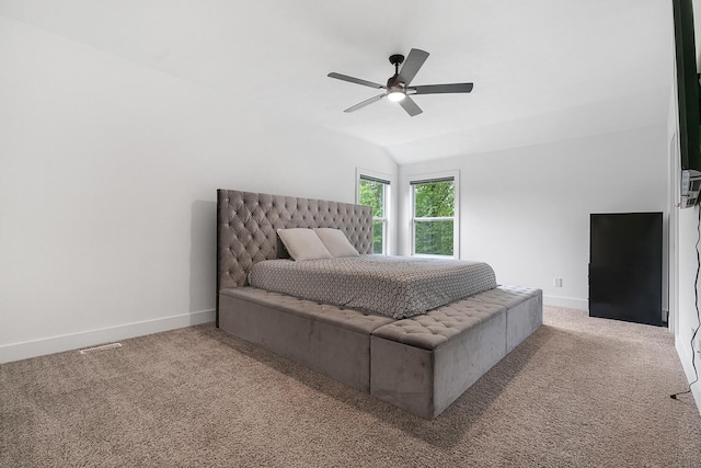 2034 Sienna St, Kalamazoo, MI 49009 - carpeted bedroom with baseboards, vaulted ceiling, and a ceiling fan