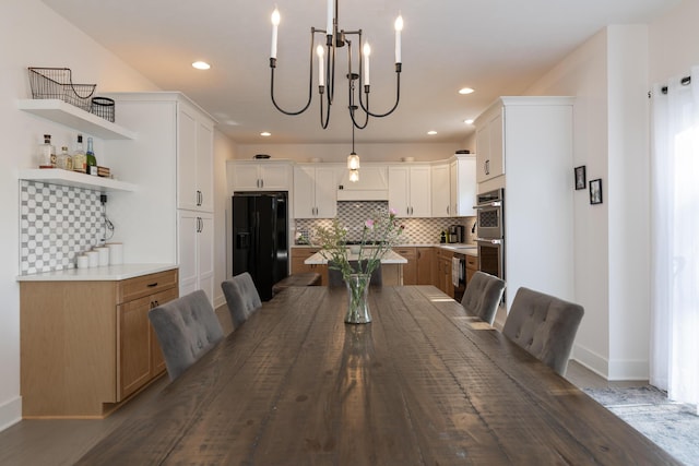 2034 Sienna St, Kalamazoo, MI 49009 - dining space featuring a chandelier, baseboards, recessed lighting, and dark wood finished floors