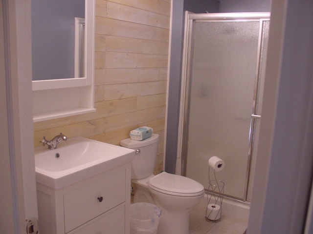 10832 Eagle Cove Dr, South Lyon, MI 48178 - full bath featuring wood walls, a shower stall, vanity, tile patterned flooring, and toilet