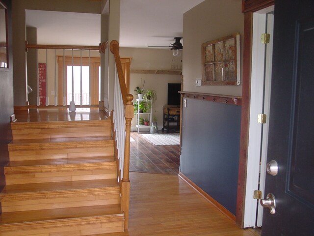 10832 Eagle Cove Dr, South Lyon, MI 48178 - staircase with a ceiling fan and wood finished floors
