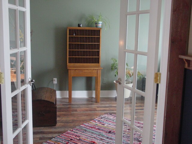 10832 Eagle Cove Dr, South Lyon, MI 48178 - doorway featuring french doors and wood finished floors