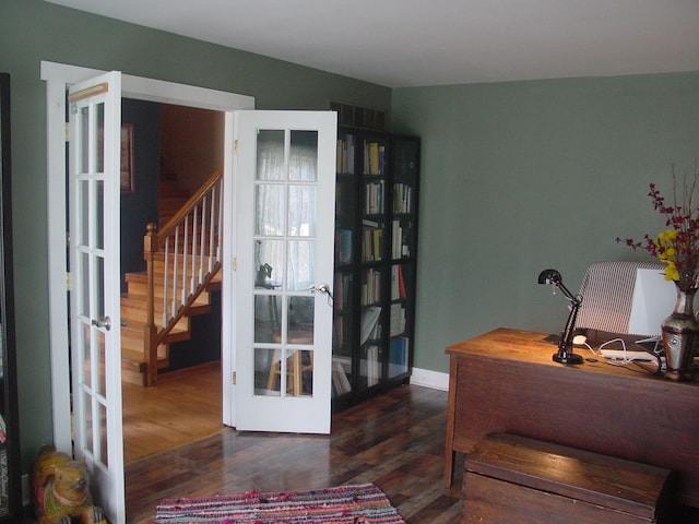 10832 Eagle Cove Dr, South Lyon, MI 48178 - office with french doors, wood finished floors, and baseboards
