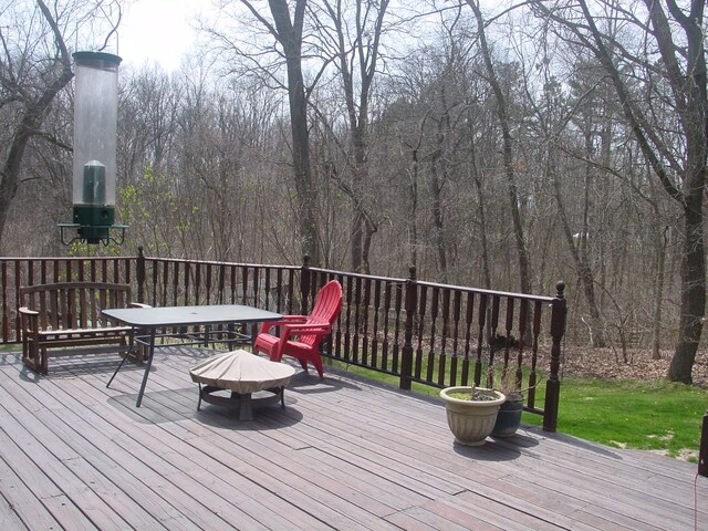 10832 Eagle Cove Dr, South Lyon, MI 48178 - deck featuring an outdoor fire pit