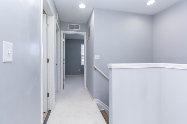 951 Barclay Cir Unit 48, Rochester Hills, MI 48307 - hallway with an upstairs landing, light carpet, recessed lighting, and baseboards