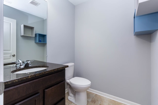 951 Barclay Cir Unit 48, Rochester Hills, MI 48307 - half bathroom featuring toilet, vanity, and baseboards