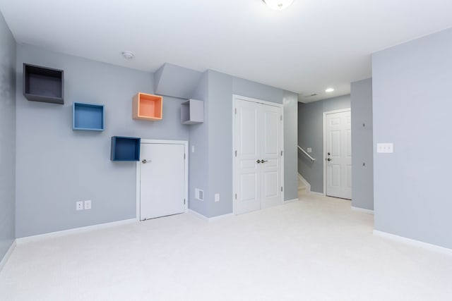 951 Barclay Cir Unit 48, Rochester Hills, MI 48307 - unfurnished living room featuring light carpet, baseboards, and recessed lighting
