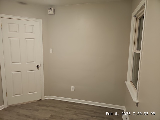 1778 Reo Ave, Lincoln Park, MI 48146 - spare room featuring dark wood-type flooring and baseboards