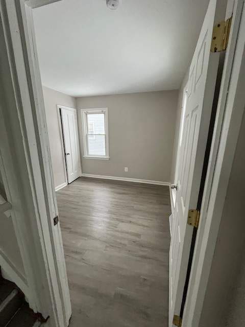 1778 Reo Ave, Lincoln Park, MI 48146 - unfurnished bedroom featuring baseboards and wood finished floors
