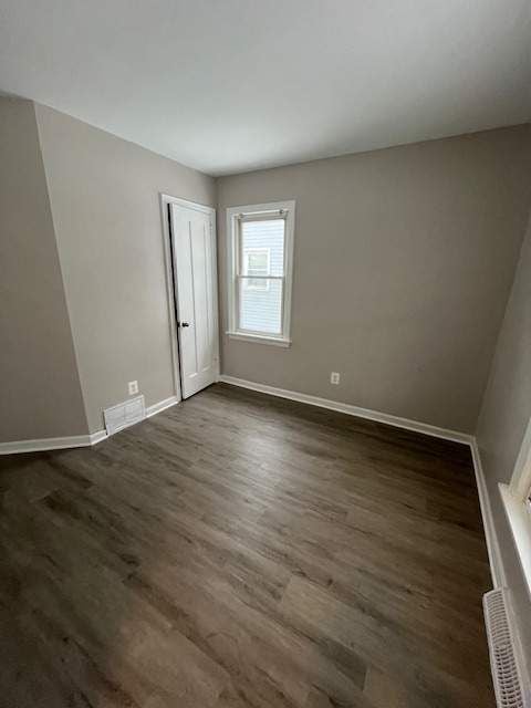 1778 Reo Ave, Lincoln Park, MI 48146 - unfurnished room with dark wood finished floors and baseboards