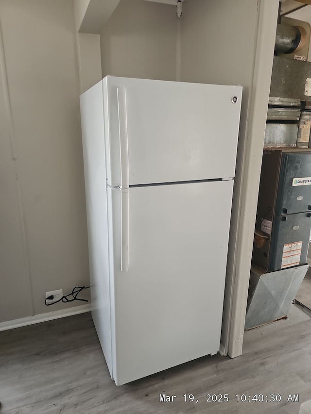 1778 Reo Ave, Lincoln Park, MI 48146 - kitchen with freestanding refrigerator and wood finished floors