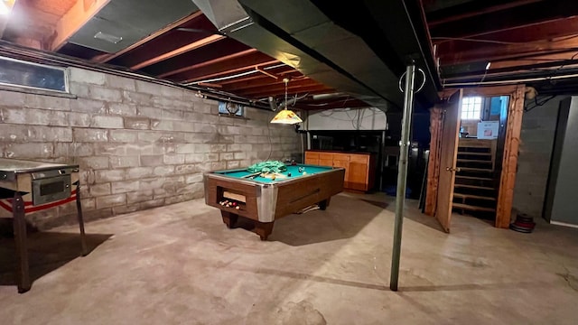 1821 W Hansen Rd, Scottville, MI 49454 - playroom featuring unfinished concrete flooring and billiards