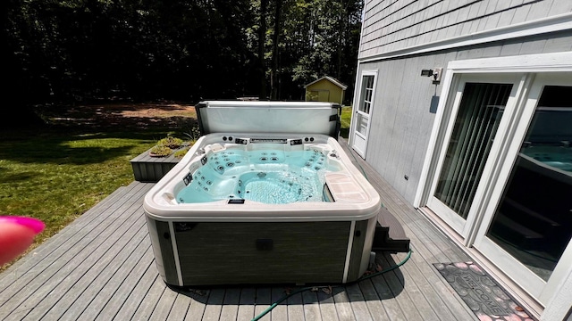 1821 W Hansen Rd, Scottville, MI 49454 - wooden deck with a hot tub and a lawn
