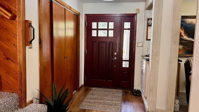 1821 W Hansen Rd, Scottville, MI 49454 - doorway to outside with wood finished floors and baseboards