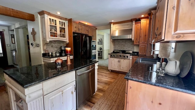 1821 W Hansen Rd, Scottville, MI 49454 - kitchen featuring ventilation hood, appliances with stainless steel finishes, wood finished floors, decorative backsplash, and glass insert cabinets