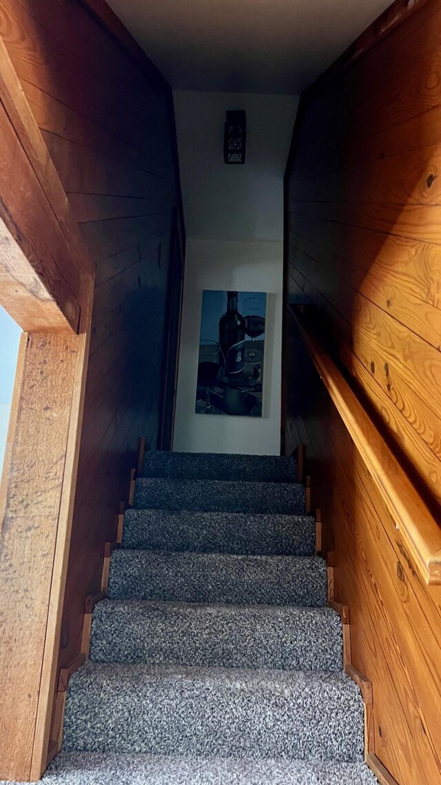 1821 W Hansen Rd, Scottville, MI 49454 - staircase with wood walls