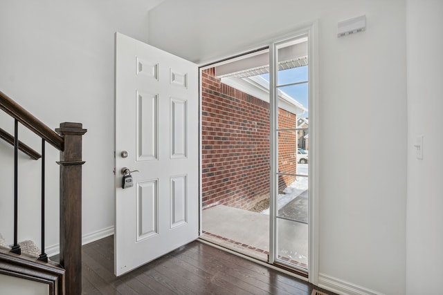 20859 Hasenclever Dr, South Lyon, MI 48178 - entryway with stairway, dark wood-style flooring, and baseboards