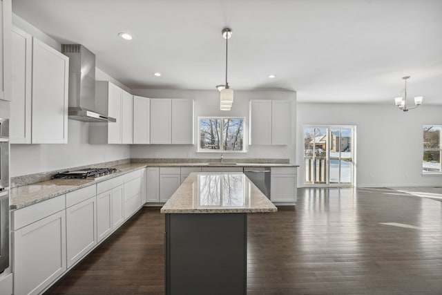 20859 Hasenclever Dr, South Lyon, MI 48178 - kitchen featuring wall chimney range hood, stainless steel appliances, recessed lighting, a sink, and dark wood-style flooring