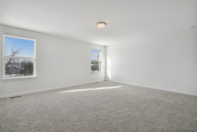 20859 Hasenclever Dr, South Lyon, MI 48178 - empty room featuring carpet and baseboards