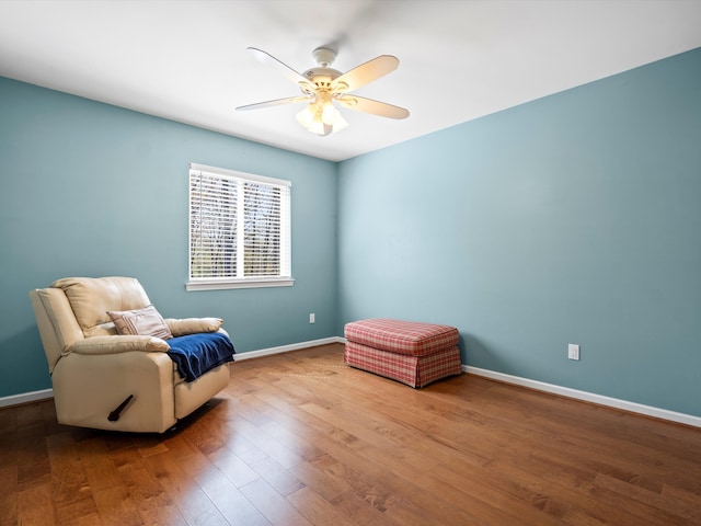 7111 Tucker Rd, Holly, MI 48442 - sitting room with wood finished floors, a ceiling fan, and baseboards