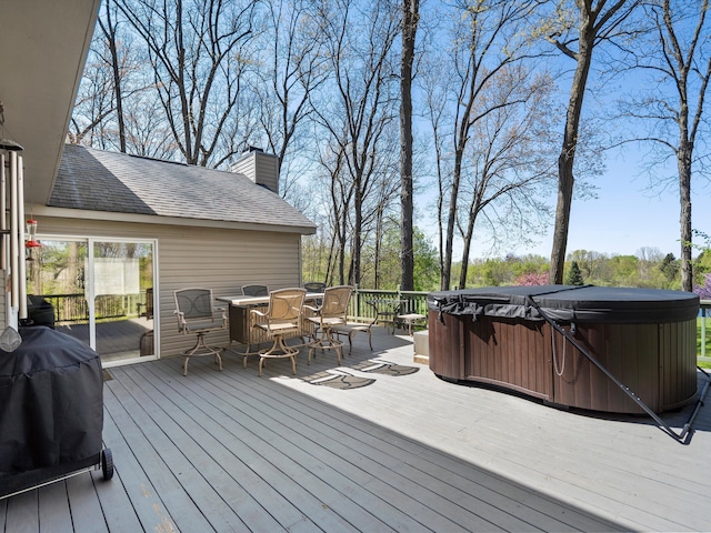7111 Tucker Rd, Holly, MI 48442 - wooden deck featuring a hot tub, outdoor dining space, and area for grilling