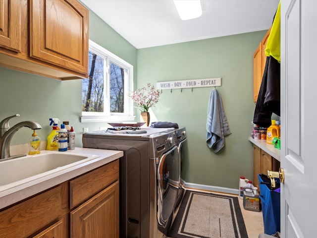 7111 Tucker Rd, Holly, MI 48442 - washroom featuring cabinet space, washing machine and clothes dryer, and baseboards