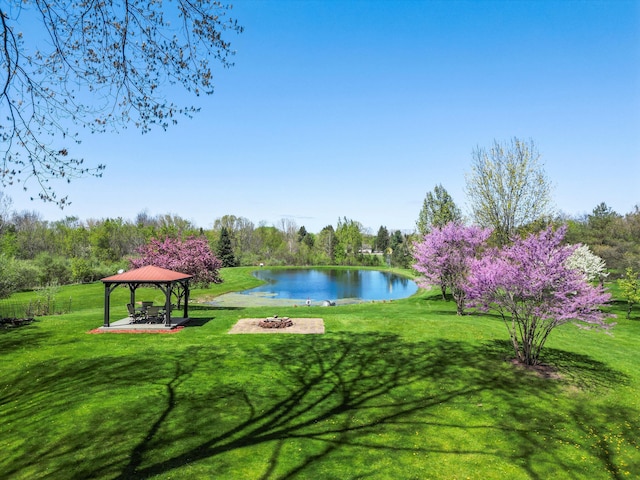 7111 Tucker Rd, Holly, MI 48442 - surrounding community with a gazebo, an outdoor fire pit, a water view, and a yard
