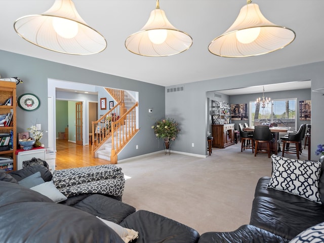 7111 Tucker Rd, Holly, MI 48442 - carpeted living area with a chandelier, stairs, and baseboards