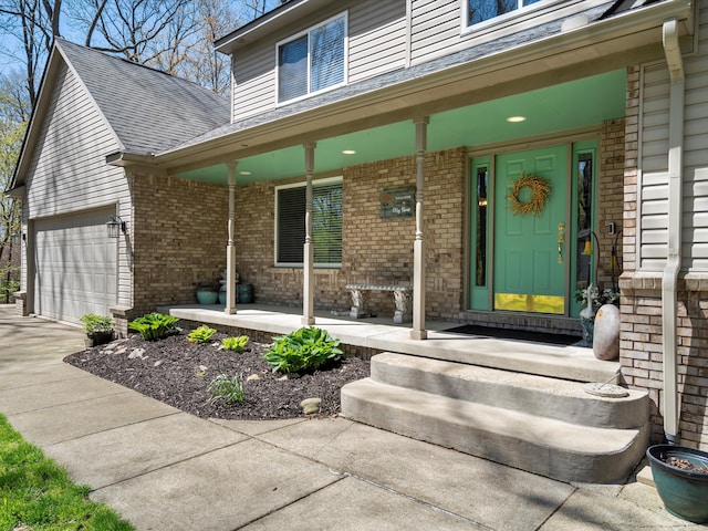 7111 Tucker Rd, Holly, MI 48442 - doorway to property with a porch, brick siding, roof with shingles, and driveway