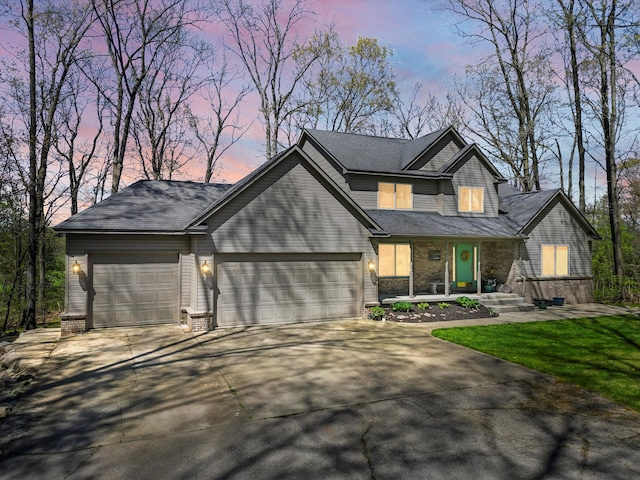7111 Tucker Rd, Holly, MI 48442 - view of front facade featuring a garage, concrete driveway, and brick siding
